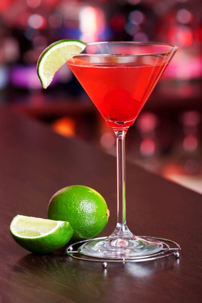 Homemade Cosmopolitan Cocktail garnished with a Lime Wedge