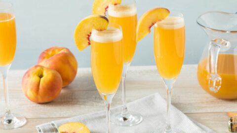 Peach Bellini Mimosas with Champagne in Wine Glasses