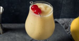 Refreshing Banana Daiquiri Cocktail with Cherries