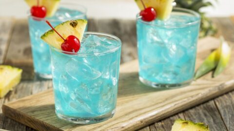 Refreshing Blue Hawaiian Cocktail Punch with Pineapple and Cherry