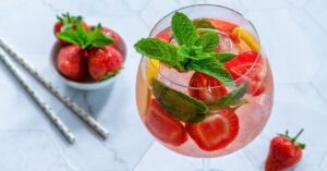 Refreshing Gin and Tonic Prosecco Cocktail with Strawberries and Mint