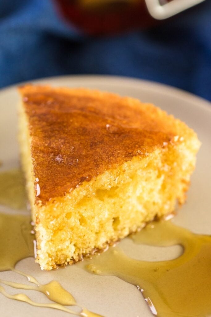 Slice of Cornbread with Honey in a Plate