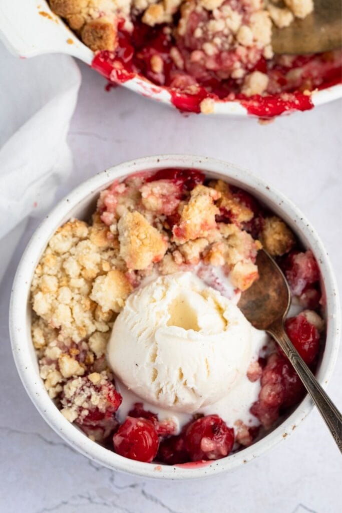 Cherry cobbler with cake mix with Ice Cream served in a bowl
