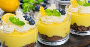 Sweet Homemade Lemon Curd Mousse with Whipped Cream and Blueberries