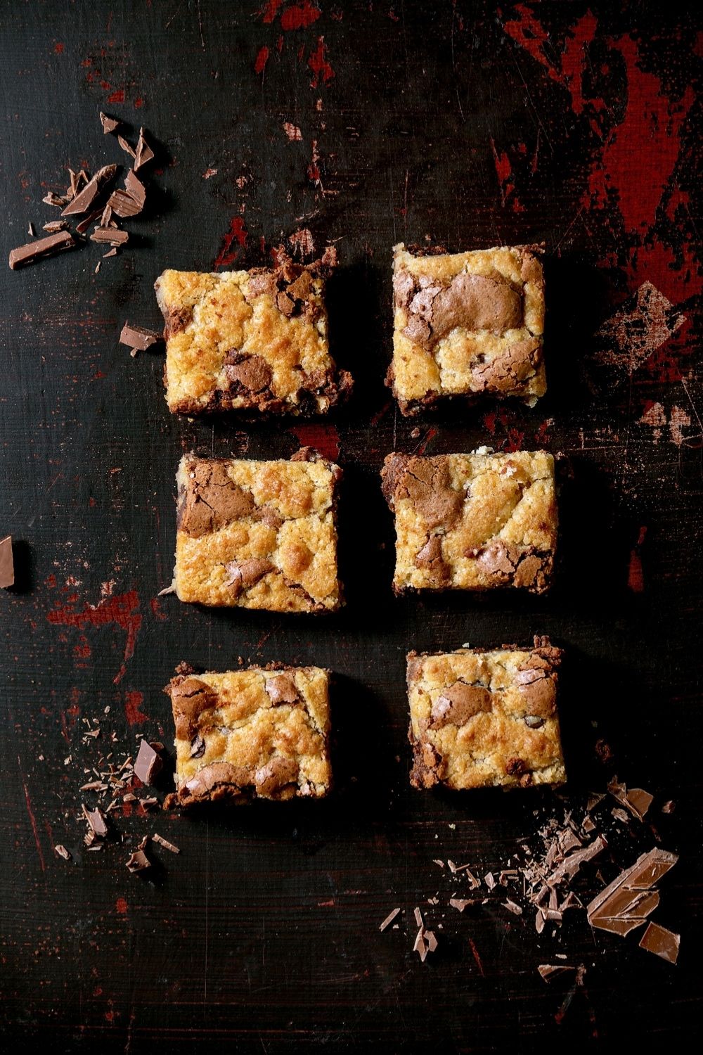 6 Brookie Squares on a Table with Chocolate Shavings All Around