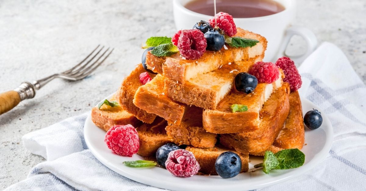 French Toast Bread Sticks with Berries Poured with Honey