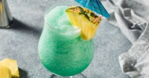 Homemade Boozy Blue Hawaiian Cocktail with Pineapple