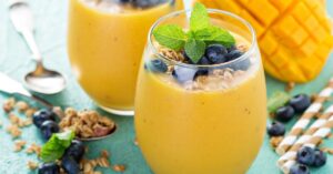 Mango Smoothie with Fresh Blueberries in a Glass