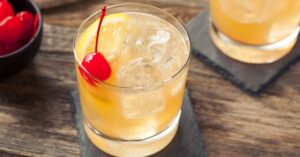 Refreshing Whiskey Sour Cocktail with Cherry