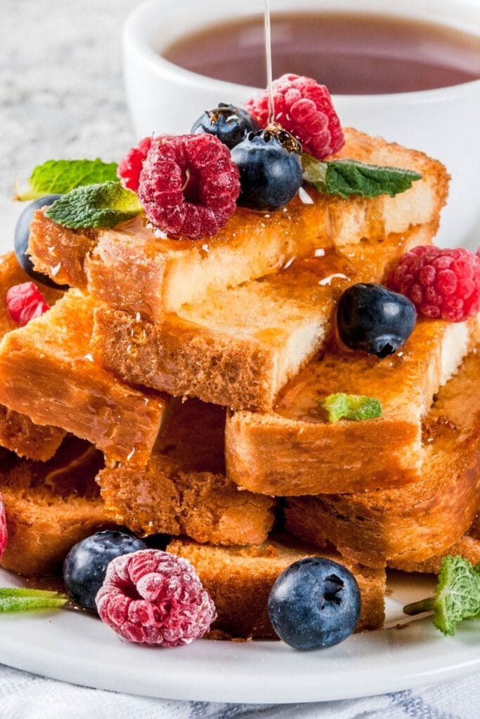 Soft and Crispy French Toast Bread Sticks Poured with Honey