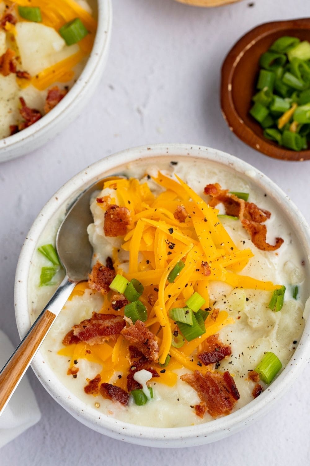 Starchy and Creamy Potato Soup with Cheese, Bacon and Green Onions