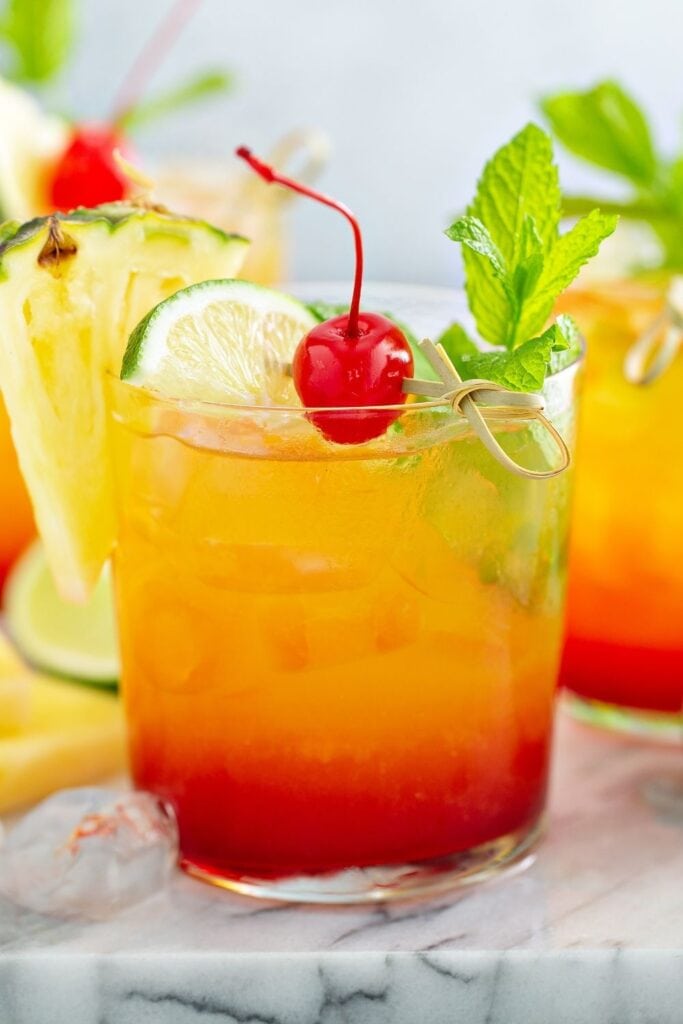 Tequila Sunrise with Grenadine, Cherry and Lime