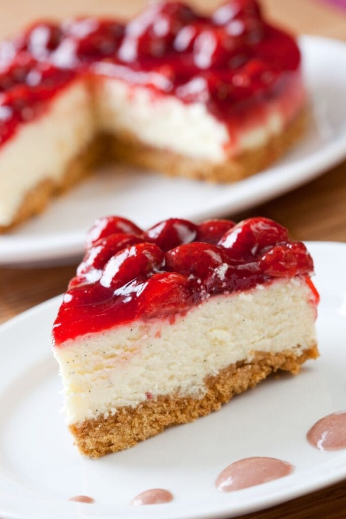 A Slice of Cheesy Cheesecake with Strawberry Pie Filling
