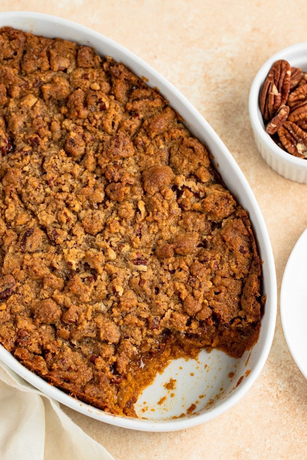 Sweet Potato Casserole and a bowl of walnuts on the side