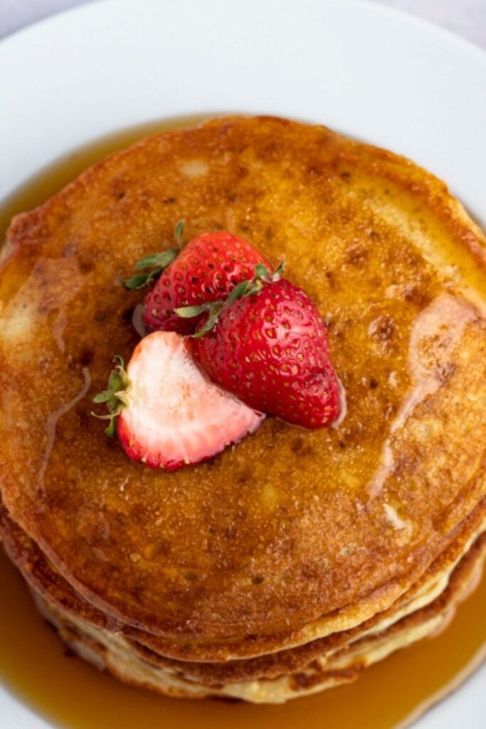 Soft and Fluffy Pancakes with Fresh Strawberries