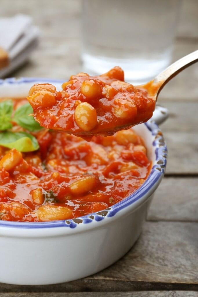 Spoon of Delicious Butter Bean with Tomato Sauce