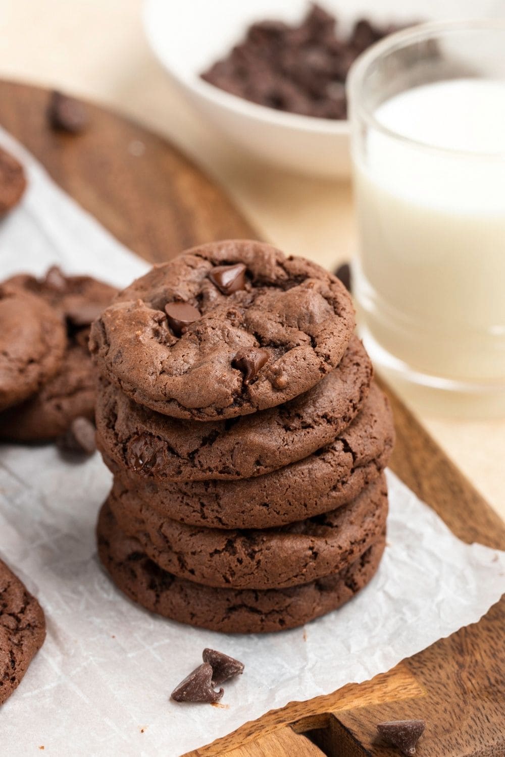 A Stack of Chocolate Cake Mix Cookies with a Glass of Milk to the Side