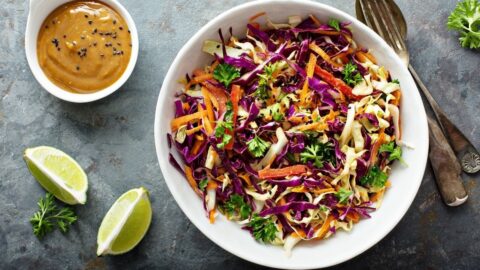 Bowl of Coleslaw with Lime and Peanut Butter Sauce