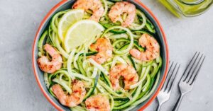 Bowl of Zucchini Noodles with Lemons and Shrimp