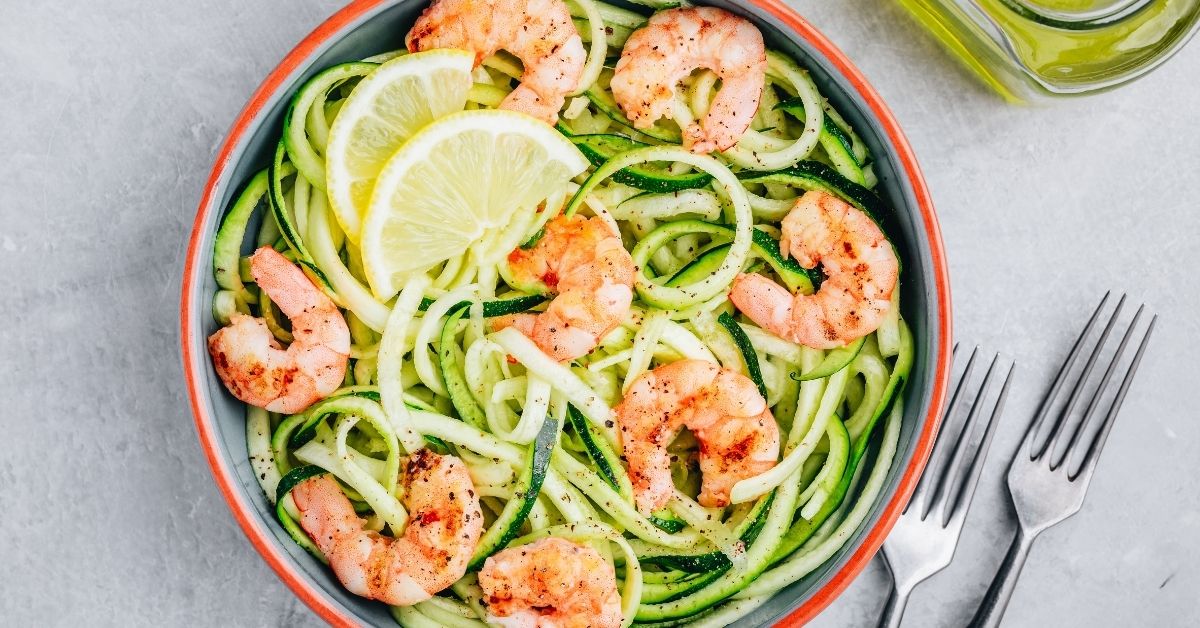 Bowl of Zucchini Noodles with Lemons and Shrimp