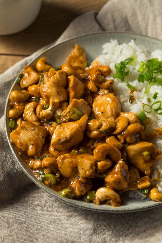 Easy Thai Chicken Recipes including Buttered Chicken with Cashew Nuts and White Rice served in a bowl