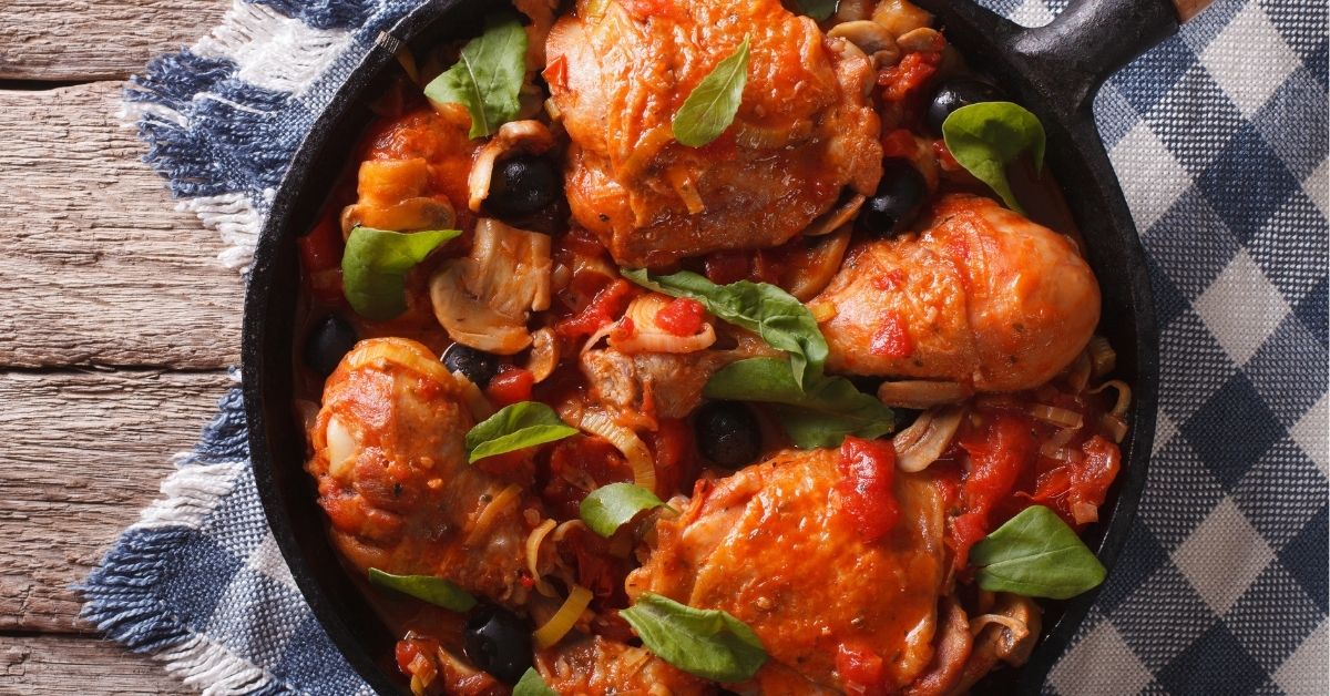 Cacciatori Chicken with Mushrooms and Olives in a Cast Iron Pan