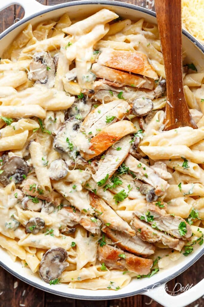 Creamy chicken alfredo is a one pot meal that's ready in less than 20 minutes! This classic comfort food combines seared chicken, brown mushrooms, penne pasta, and parmesan cheese in a thick and creamy sauce. 