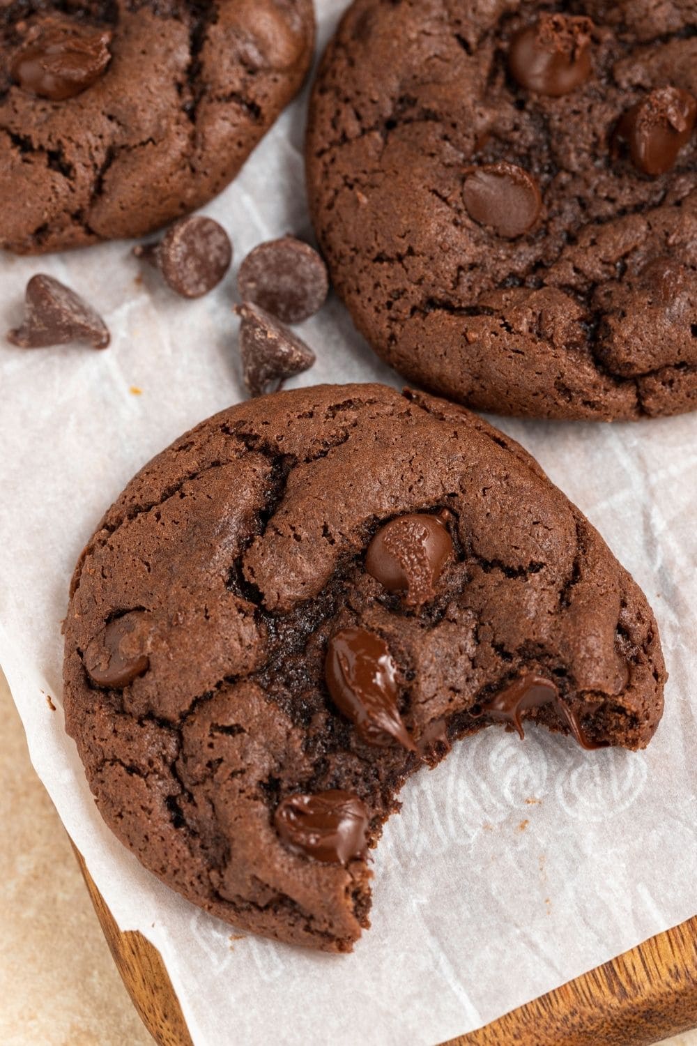 Close Up of Chocolate Cookies with Chocolate Chips- One Has Bite Out of It