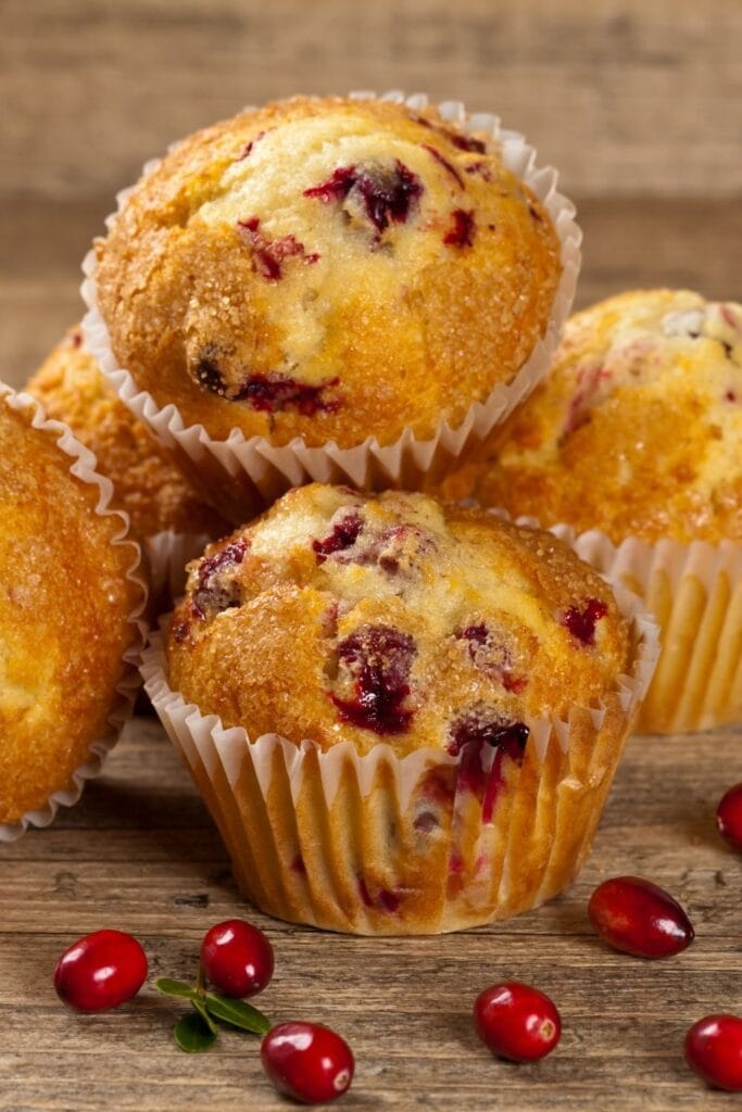 25 ways to use leftover cranberry sauce. Photo shows Cranberry Sauce Muffins with Fresh Cranberries
