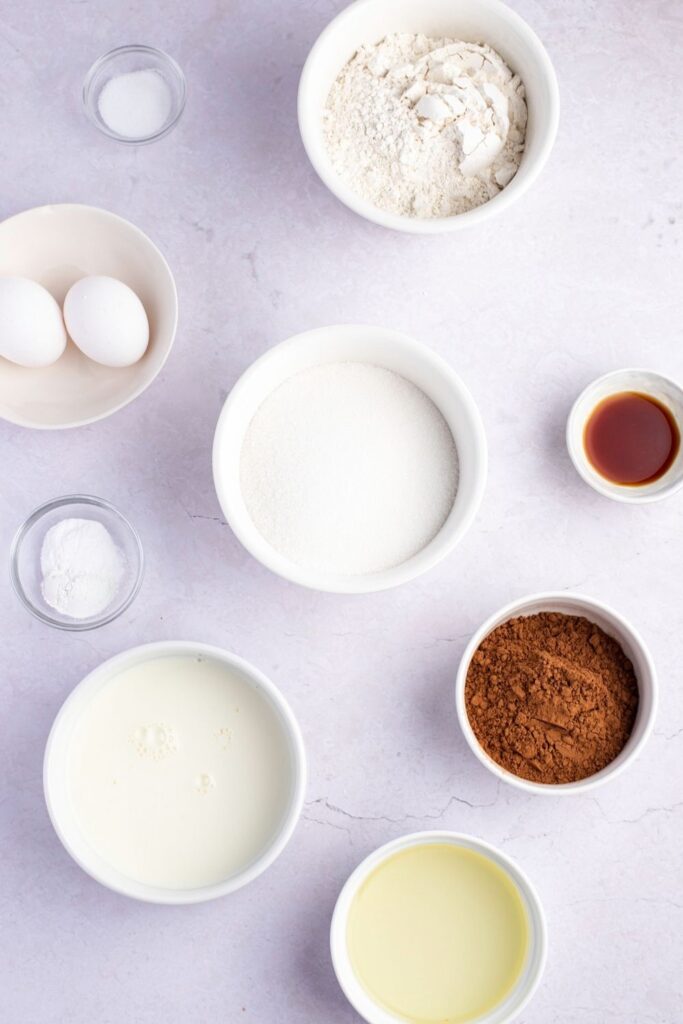 Hershey's Chocolate Cake Ingredients: Sugar, Flour, Hershey's Cocoa, Baking Powder, Salt, Eggs, Milk, Oil and Vanilla