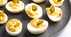 Homemade Appetizing Deviled Eggs with Pickles, Paprika and Mustard