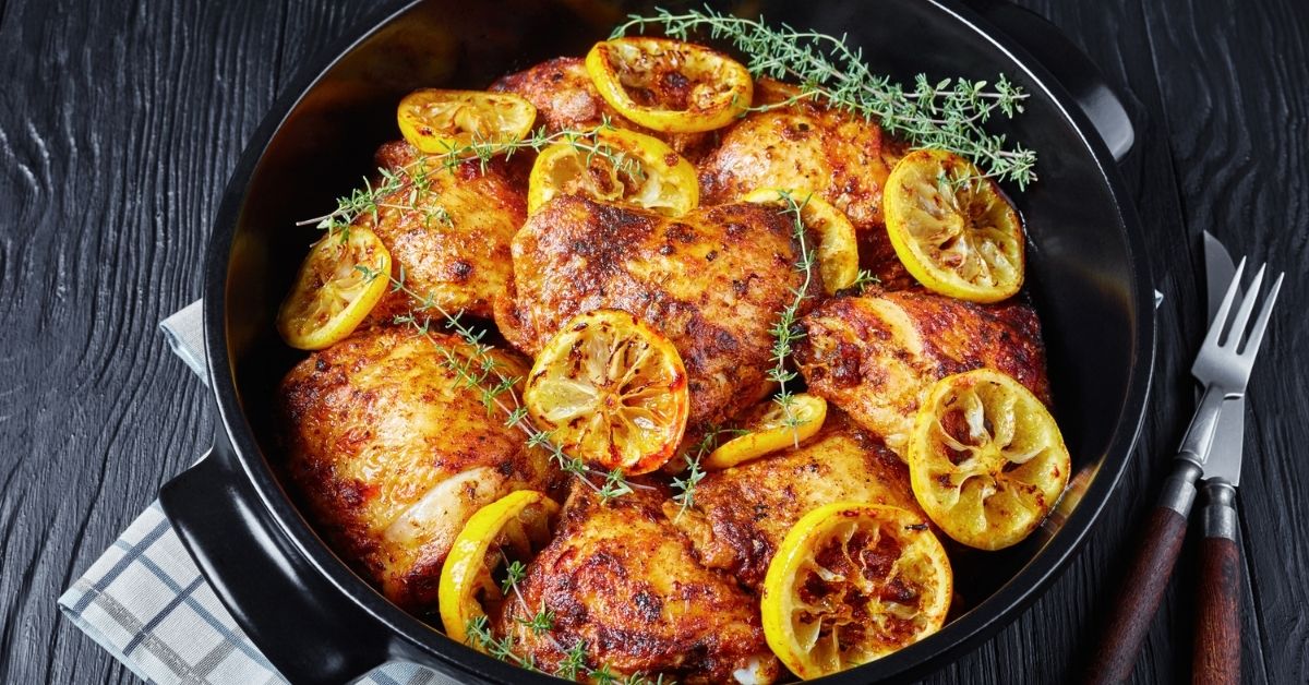 Homemade Baked Chicken Thighs with Roasted Lemons in a Dutch Oven