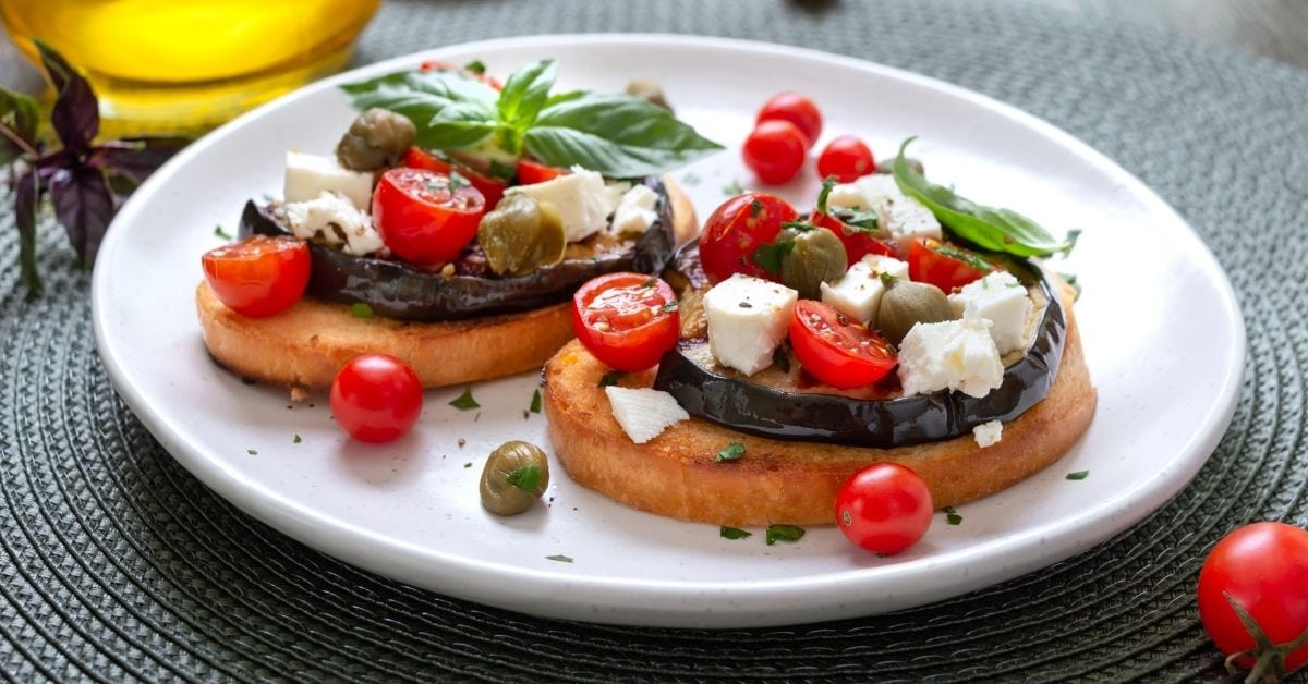Homemade Bruschetta with Eggplant, Capers, Tomatoes and Feta Cheese