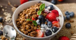 Homemade Granola with Berries and Yogurt in a Bowl