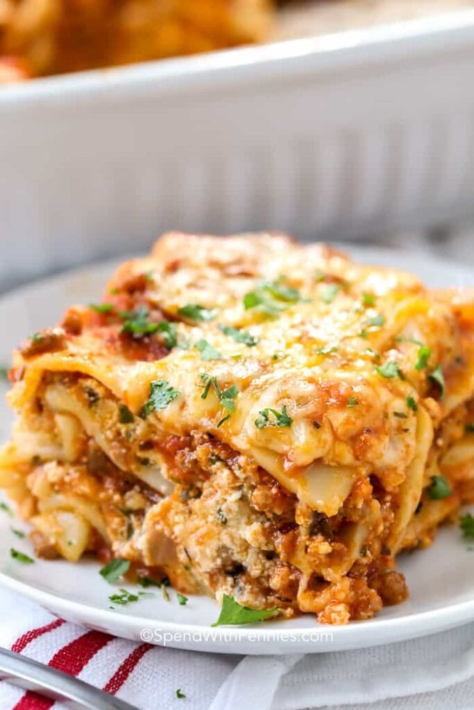 Homemade lasagna with layers of al dente pasta, ground beef, tomato sauce, and melted cheese.