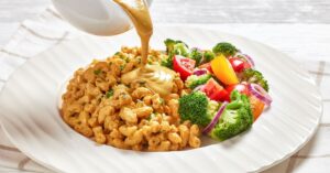 Mac and Cheese with Vegetables Poured with Nutritional Yeast Sauce