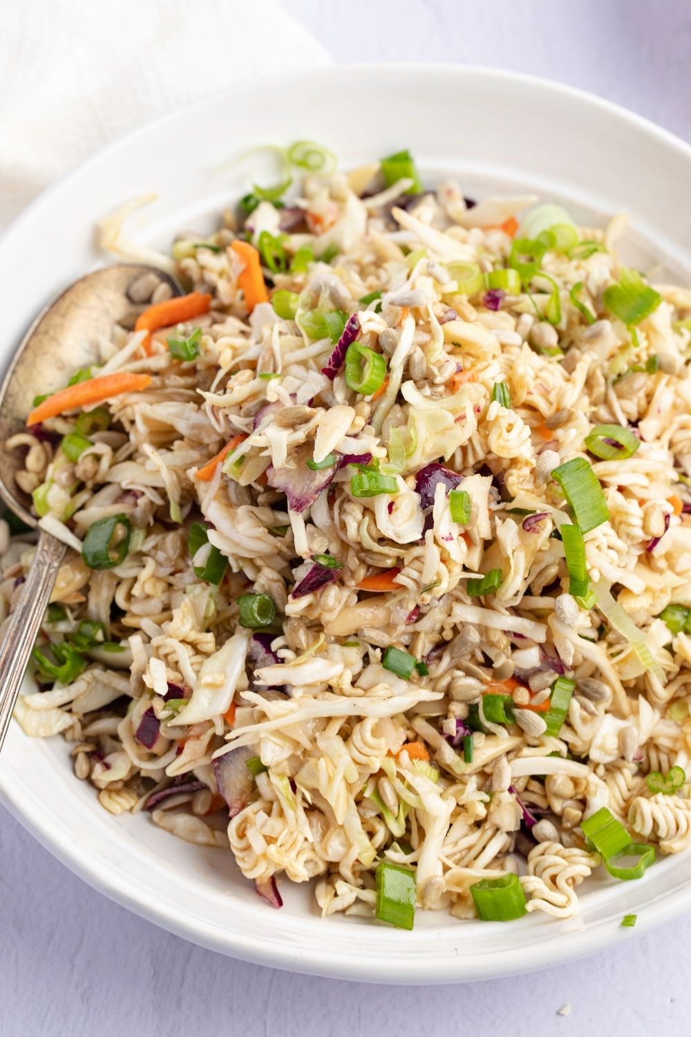 Oriental Coleslaw with Ramen Noodles, Carrots, Red Onions, Green Onions, and Cabbage