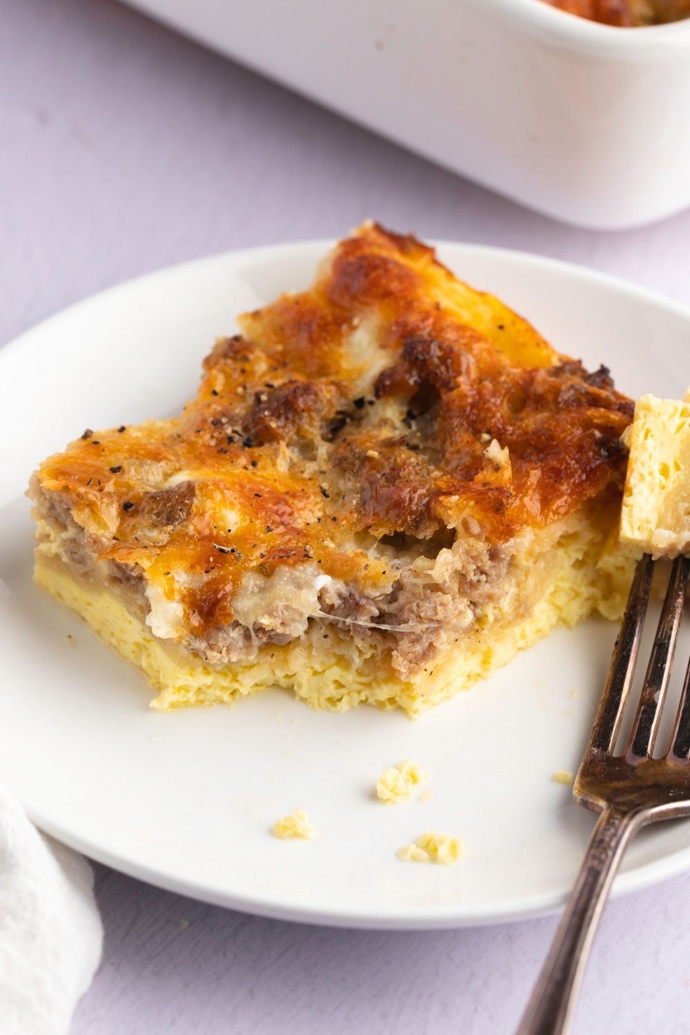 A Slice of Crescent Roll Breakfast Casserole with Ground Pork Sausage and Egg