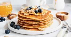 A Stack of Homemade Banana Pancakes with Blueberries