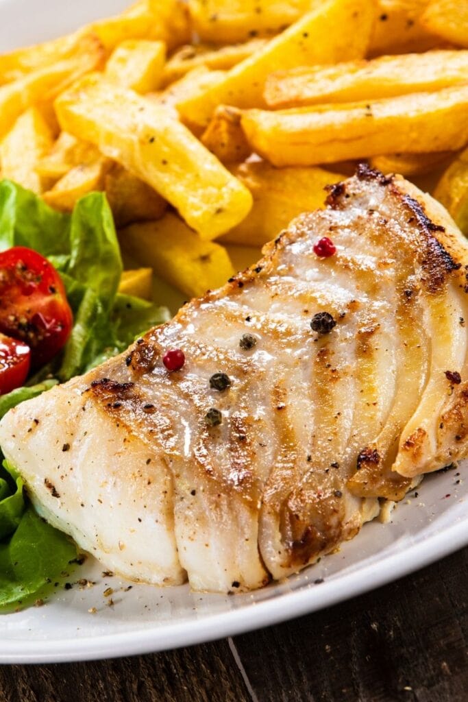 Baked Cod Loin with French Fries and Vegetables