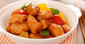 Chinese Sweet and Sour Pork in a White Bowl
