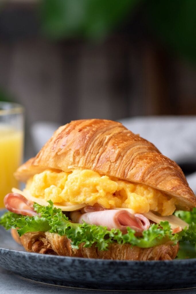 Croissant Breakfast Sandwich with Ham and Scrambled Eggs