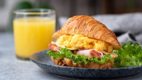 Delicious Homemade Croissant Sandwich with Ham and Scrambled Eggs