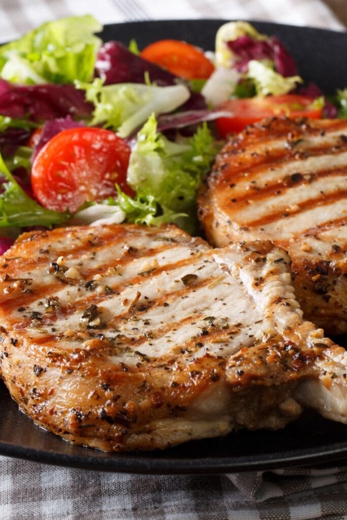 10 Best Weight Watchers Pork Chop Recipes. Photo shows Grilled Porkchops with Vegetable Salad