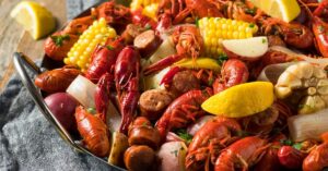 Homemade Crawfish Boil with Corn, Lemons and Sausages
