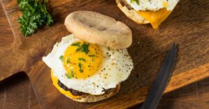 Homemade English Muffins with Sausages and Eggs for Breakfast
