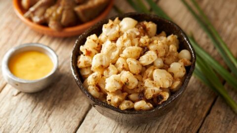 Homemade Hominy and Pork Rind in a Black Bowl