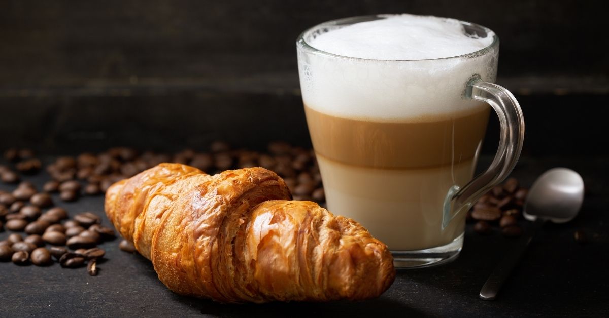 https://insanelygoodrecipes.com/wp-content/uploads/2022/02/Hot-Latte-Macchiato-with-Croissant.jpg