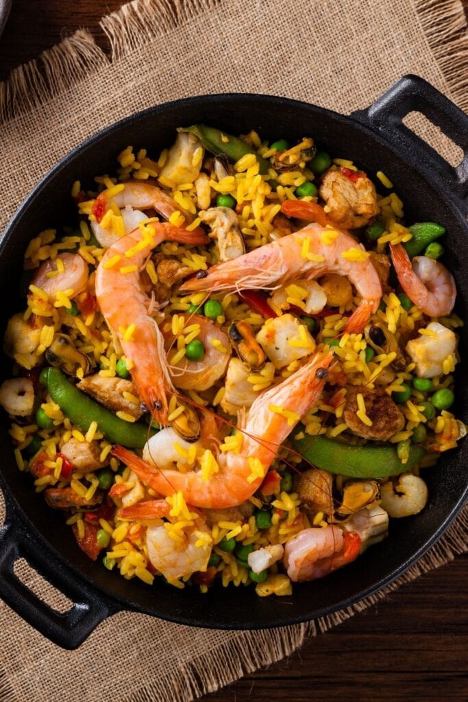 17 Easy Chicken and Shrimp Recipes featuring Shrimp and Chicken Paella with Green Beans and Peas