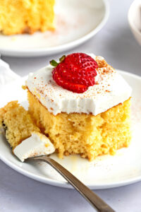 Sliced Homemade Tres Leches Cake with Strawberries